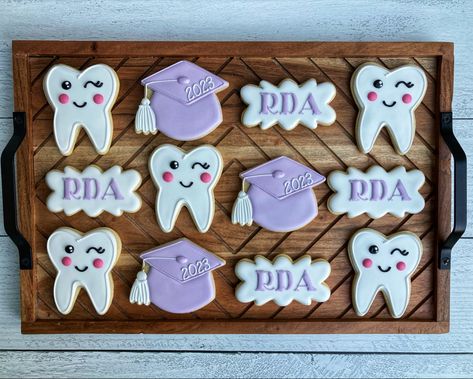 Dental assistant graduation cookies Tooth cookies Dental Assistant Party Ideas, Dental Assistant Graduation Party, Dental School Party, Dental Hygiene Cookies, Dental School Acceptance Party, Rdh Graduation Party, Dental Assistant Graduation Party Ideas, Dental Hygienist Graduation Party, Dental Cookies