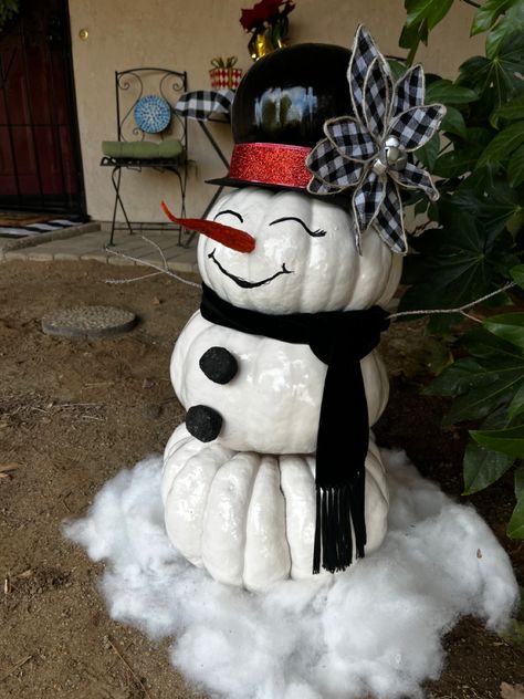 Made this snowman from our Fall decor pumpkins. Spray painted real lumpkins, used real coal for the buttons, painted the carrot (to make it pop) painted the face with acrylic paint. I did bleach bath the pumpkins in November. Snowman Made Out Of Pumpkins, Snowman Contest Ideas, Santa Pumpkin Painted, Stackable Snowman, Stackable Pumpkins, Snowman Pumpkin, Stacking Pumpkins, Fall Decor Pumpkins, Bleach Bath