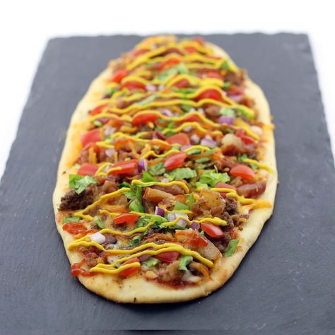 Bacon Cheeseburger Flatbread Recipe | DudeFoods.com Cheeseburger Flatbread, Teriyaki Pork Tenderloin, Dude Food, Teriyaki Pork, Ketchup And Mustard, Cheese Flatbread, Flatbread Recipe, Beef Bacon, Bbq Bacon