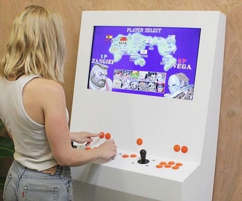 Bring all the fun of an arcade into your home without taking up too much space using the modern retro arcade cabinet. It sports a sleek minimalist design that attaches to the wall, lets you play all your favorite games, and lets you play either single or multiplayer. Retropie Arcade, Video Game Cabinet, Pi Arcade, Arcade Cabinet Plans, Arcade Bartop, Retro Arcade Machine, Arcade Console, Classic Cabinets, Arcade Joystick