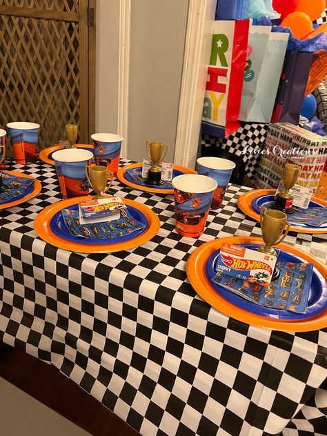 A small setup to match our hot wheels party Hot Wheels Birthday Table Decor, Hot Wheels Birthday Party Ideas Favors, Hot Wheels Party Favors Ideas, Hot Wheels Table Decorations, Hot Wheels Birthday Party Food, Hot Wheels Birthday Party Decorations, Hot Wheels Dessert Table, Hot Wheels Birthday Decorations, Hot Wheels 3rd Birthday Party Ideas