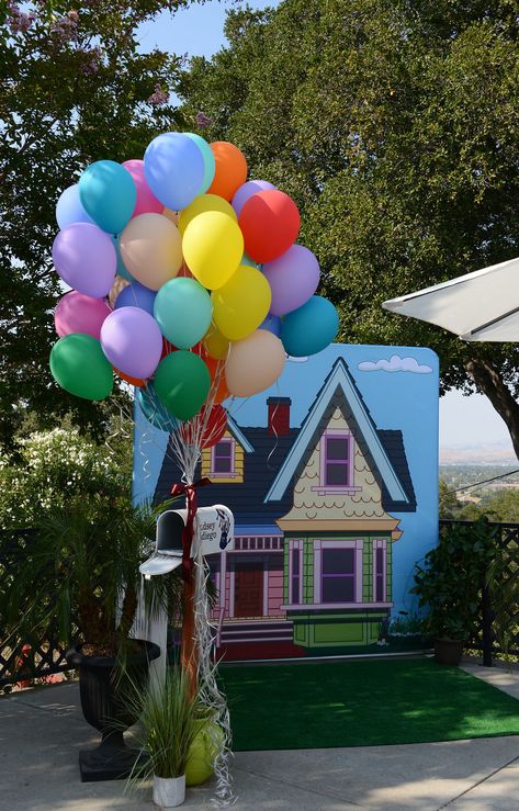 We can't believe how AWESOME the photobooth / UP movie inspired vingette turned out! Adventure is out there!!  printing and backdrop frame by RedCarpets.com Up Movie Backdrop, Disney Up Parade Float, Up Theme Backdrop, Up Movie Trunk Or Treat, Up Movie Decorations Party Ideas, Up Themed Gender Reveal, Up Party Theme Disney, Up Gender Reveal Theme, Up Movie Decorations