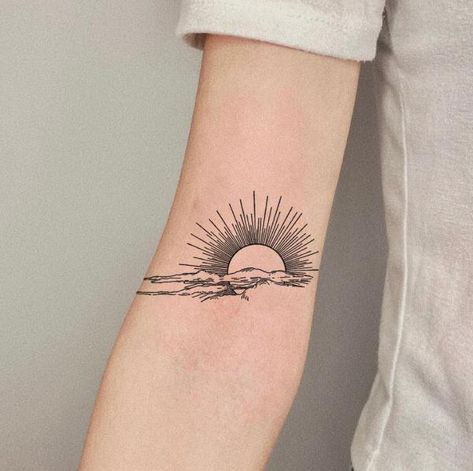 Rising sun and clouds tattoo above inner elbow Sun Elbow Tattoos For Women, Rising Sun Tattoos, Above Elbow Tattoo, Inner Elbow Tattoos, Sunrise Tattoo, Tattoo Sonne, Running Tattoo, Earthy Tattoos, Sun Tattoo Designs