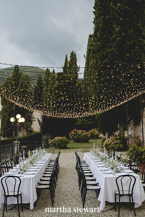 The beauty of string lights is that they aren't too heavy and can be strung nearly anywhere. Take this lovely al fresco dinner, where Italian Eye and GB Audio used a few poles with bases to install twinkling strands. What that means is they can go over any part of your ceremony, cocktail hour, or reception. #weddingideas #wedding #marthstewartwedding #weddingplanning #weddingchecklist Wedding Table Planner, Country Wedding Reception, Wedding Reception Hall, Wedding Reception Lighting, Rustic Wedding Reception, String Lights Wedding, Outdoor Wedding Inspiration, Martha Stewart Weddings, Rustic Country Wedding