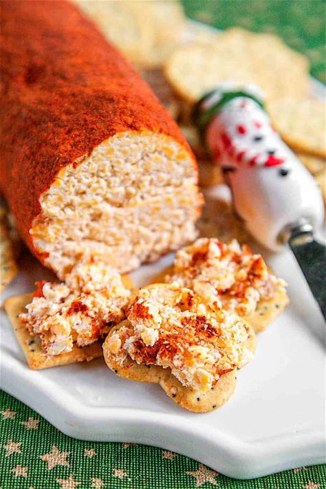 Cheese Roll - the BEST cheese ball recipe EVER! Super easy to make and even easier to eat. Cheddar cheese, cream cheese, dry mustard, hot sauce, garlic, mayonnaise, and Worcestershire - mix together and roll in a mixture of chili powder and paprika. Great for parties! I am totally addicted to this cheese roll! I could literally eat the whole thing! Serve with crackers or veggie slices. #appetizer #glutenfree #lowcarb #partyfood #gameday #cheese The Best Cheese Ball, Best Cheese Ball, Cheese Log Recipes, Cheese Roll Recipe, Garlic Mayonnaise, Cheese Log, Cheese Roll, Xmas 2022, Cheese Stuffed Peppers