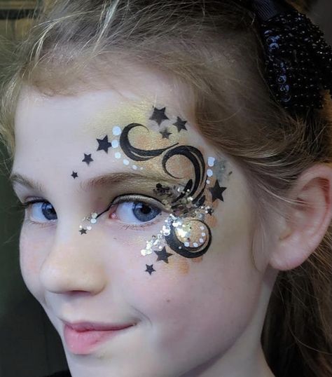 New Year’s Eve Face Paint, Face Painting Glitter, New Years Face Paint, Sky Face Paint, Firework Face Paint, Cosmic Makeup, Gold Face Paint, Eye Face Painting, Animal Face Paintings