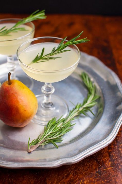 Pear Rosemary Cocktail - Rosemary infused simple syrup and pear vodka make the perfect autumn cocktail. | tamingofthespoon.com Infused Simple Syrup, Autumn Cocktail, Pear Nectar, Rosemary Cocktail, Pear Cocktails, Pear Vodka, Rosemary Simple Syrup, Cranberry Cocktail, Strawberry Wine