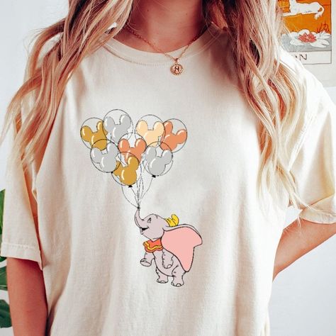 Exclusive deal alert! Dumbo with Mickey Balloon T-Shirt, Dumbo Shirt,Family Matching Tee , Magic Kingdom Shirt, available for a limited time at the incredible price of $22.00 #DumboShirt #ThePrincess #UnisexTShirt #MagicKingdom #DisneylandMatching #TheFrogShirt #KidTShirt #DisneylandTripTee #TianaShirt #HoodieSweatshirt Disney Shirts For Family Matching, Cute Disney Shirts, Magic Kingdom Shirt, Matching Disney Shirts, Mickey Balloons, Mom Sweater, Soft Cute, Disney Tees, Matching Tees