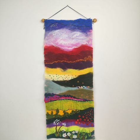 I'm thrilled to present my original abstract vertical landscape felt art, inspired by the vibrant beauty of mountains, green fields, and colorful sunsets. This piece combines needle felting, wet felting, and hand embroidery to create a rich, textured tapestry that adds warmth and character to any room. 🌿🎨 Perfect for those who love cottagecore, farmhouse decor, or simply want to add a touch of nature-inspired art to their space. Whether it's your living room, hallway, or even an oversized ba... Felt Wall Art, Vertical Landscape, Wet Felting, Felt Art, Needle Felting, Farmhouse Decor, Hand Embroidery, Nature Inspiration, Felt