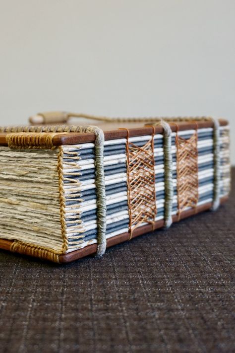 This is a handmade solid mahogany (150 mm x 210 mm) exposed spine sketching journal and notebook featuring a Celtic sewing with a coptic headband and spiral binding on hemp ropes. For more details about these books and how they're made visit ToeBeanBindery on Etsy #bookart #handmade #mahogany #woodenbook #journals #sketchbooks #bookbinding #bibliophile #exposedspine #sewing #papercraft #woodworking #bookish #designinspiration #handcrafted #makersgonnamake #woodbook #book #wood #woodwork Exposed Spine Book Binding, Open Spine Book Binding, Spiral Book Binding, Sketching Journal, Bookbinding Techniques, Book Binding Design, Bookbinding Tools, Homemade Books, Handmade Sketchbook