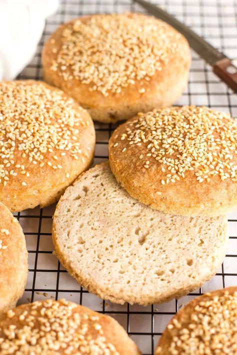 These soft and fluffy gluten-free burger buns are perfect for your summer backyard grilling party (or really anytime that you crave a good burger). Easy to make, these tender burger buns are studded with sesame seeds, and no kneading is required! Totally dairy-free too, but no one would care! | gluten-free buns | burger buns | gluten free dairy free recipes | gluten free bread recipes | gluten free yeast breads Dairy Free Hamburger Buns, Gluten Free Hamburger Buns Recipe, Gluten Free Burger Buns, Bread Recipes Gluten Free, Buns Recipe Easy, Grilling Party, Gluten Free Hamburger Buns, Gluten Free Hamburger, Gluten Free Burger