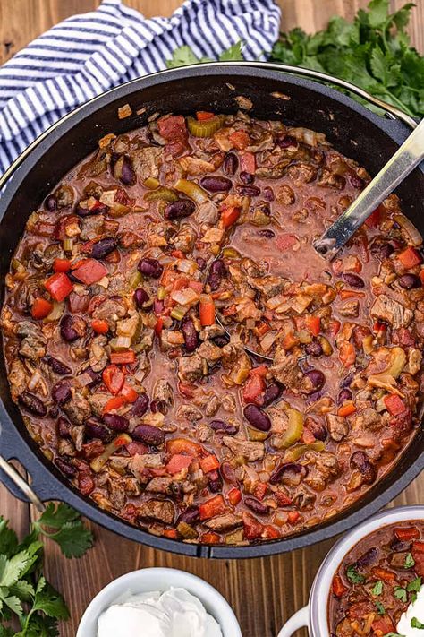 Cast Iron Dutch Oven Chili https://thestayathomechef.com/dutch-oven-chili/ Ladle In Red Chili, Cast Iron Chilli Recipe, Chili In Dutch Oven, Chili Dutch Oven, Best Chicken Chili Recipe, Dutch Oven Chili Recipe, Dutch Oven Chili, Campfire Chili, Backyard Campfire