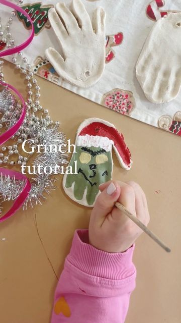 Kelly Oester | Content Creator on Instagram: "This is our third year making these and these little hands seemed to have grown 'three sizes this day' 😈✨🎄 ✨Grinch Salt Dough Handprint Ornament✨ #diy #makeitwithmichaels #hgtvhandmade #diychristmas #saltdoughornaments #diyornaments" Christmas Tree Salt Dough Ornaments, Salt Dough Ornaments Grinch, Turkey Salt Dough Crafts, Elf Handprint Ornament, Grinch Hand Ornament, Salt Dough Reindeer Footprint, Grinch Salt Dough Ornament, Diy Clay Ornaments For Kids, Diy Baby Handprint Ornament