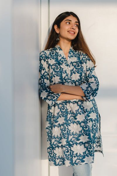 Product Description: Refreshing, earth friendly and versatile styles add value to your daily wears. Made in comfortable cotton fabric and Sanganeri hand block print. Features a Collar Neck with button detailing in front Short kurta with full sleeves along with side pockets. Size and Fit: Model height is 5'3" and is wearing a Size S Fit: Straight fit Contents: 1. Kurta Material:  This kurta is made up of Slub cotton. Short Kurti Designs, Cotton Short Tops, Indian Kurtis, Desi Outfits, Kurtas For Women, Kurta Cotton, Short Kurta, Short Kurti, Simple Kurti Designs