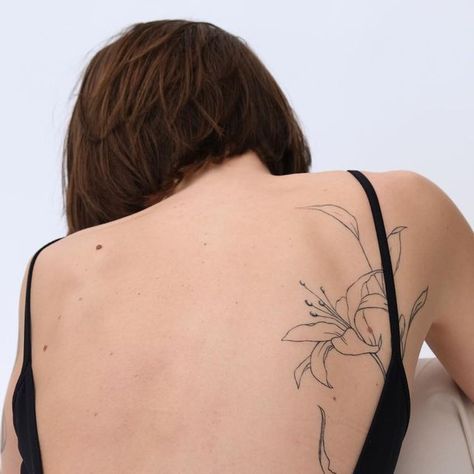 Ethereal Art Tattoo, Gillian East Tattoo, Abstract Back Tattoo Women, Long Leg Tattoo, Lily Tattoo Back, Delicate Back Tattoo, Lily Back Tattoo, Tattoo Lilly, Back Flower Tattoo