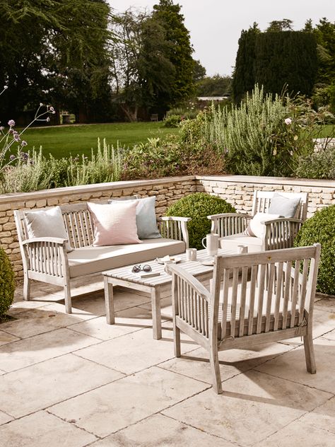 To create an outdoor living space start by investing in some classic key pieces like a garden bench, dining or lounge set. We love this lounge set made from solid eucalyptus wood with a beautiful washed finish, perfect for entertaining and relaxing in your garden. Raised Lawn, Painted Outdoor Furniture, Cottage Patio, Nice Garden, Luxury Garden Furniture, Corner Ideas, Courtyard Gardens, Wooden Garden Furniture, Rattan Outdoor Furniture