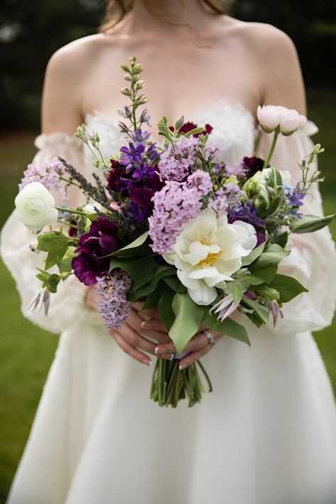 Bramble & Blossom's expertise lies in creating the perfect eco-friendly bouquets for Pittsburgh brides. Stacia's bouquet was the quintessential spring purple vibe, featuring lilac, lilac, tulips, ranunculus, lavender, delphinium, and clematis. Make your wedding day as unique and special as you are. Contact us today to book a free consultation! Photograph by Tara Bennett Photography Lilac And Peony Wedding Bouquet, Lilac Flower Bouquet Wedding, Wedding Spring Bouquets, Boho Wedding Bouquet Purple, Wedding Bouquets Bride Tulips, Wedding Flowers With Lavender, Lilac Green Wedding, Lilac And Forest Green Wedding, Lilac And Green Wedding Theme