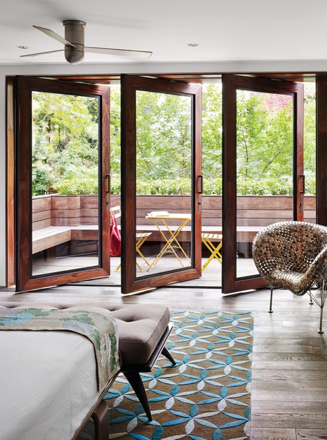 In Tia Cibani's master suite, the architect created a sizable terrace. The wood floors within the room run right out of doors, establishing a subtle sense of continuity. Thus, says Dubbeldam, “the balcony becomes part of the bedroom.” The coin chair is by Johnny Swing. The bed is from Design Within Reach. Terrasse Design, Balcony Doors, Exterior Modern, Attic Renovation, Sliding Glass Doors, Bedroom Balcony, Chelsea House, Terrace Design, Balcony Design