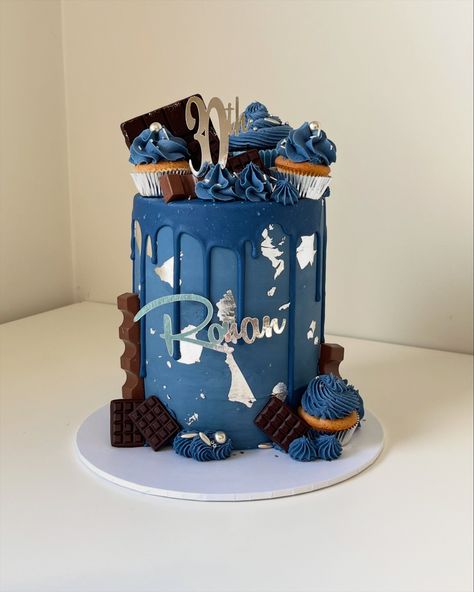 True blue baby I love you 🎶🎶🎶 are you singing…. What a stunner, this is a white chocolate ganache covered cake. Look at that curtain chocolate drip 💧and edible silver leaf to decorate! I’ve used @colour.mill denim oil based colour to colour everything ie. Chocolate ganache, chocolate drip and buttercream giving a cohesive finish. Que “Spotify play Madonna” #birthdaycake #trueblue #colourmill #denim #chocolateganache #ganashcake #cakedecorating #cakedesign #irishcakedesigner #cakeschoo... Blue Silver Cake, Ganache Covered Cake, Blue And Silver Cake, Spotify Play, 60th Cake, Irish Cake, Chocolate Caramel Cake, Silver Cake, White Chocolate Ganache