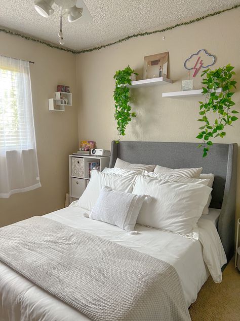 Floating Shelf Wall Bedroom, Bed With Plants Above, Shelf Over Bed With Plants, White Floating Shelves Bedroom Above Bed, White Floating Shelves Bedroom, Hanging Plant Shelf Above Bed, White Hanging Shelves Bedroom, Floating Shelves Above Bed, Bedroom Shelving Ideas Above Bed