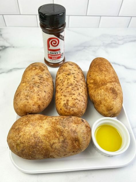 The perfect easy way to make baked potatoes in your air fryer Baked Russet Potatoes In Air Fryer, Baked Russet Potatoes, Greek Yogurt Chicken Recipes, Potatoes In Air Fryer, Starbucks Egg Bites Recipe, Low Carb Greek Yogurt, Peanut Butter Blossoms Recipe, Potatoes Crispy, Homemade Sausage Rolls