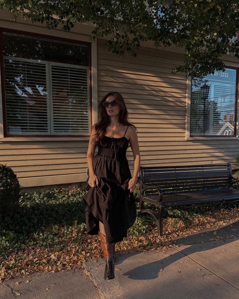 Black Midi Dress Outfit Aesthetic, Summer Dress With Boots Midi, Brown And Black Cowboy Boots Outfit, Midi With Cowboy Boots, Maxi Dress With Cowboy Boots Outfits, Cowboy Boots Midi Dress, Outfits With Black Cowboy Boots For Women, Black Dress Western Boots Outfit, Wedding Outfit With Cowgirl Boots