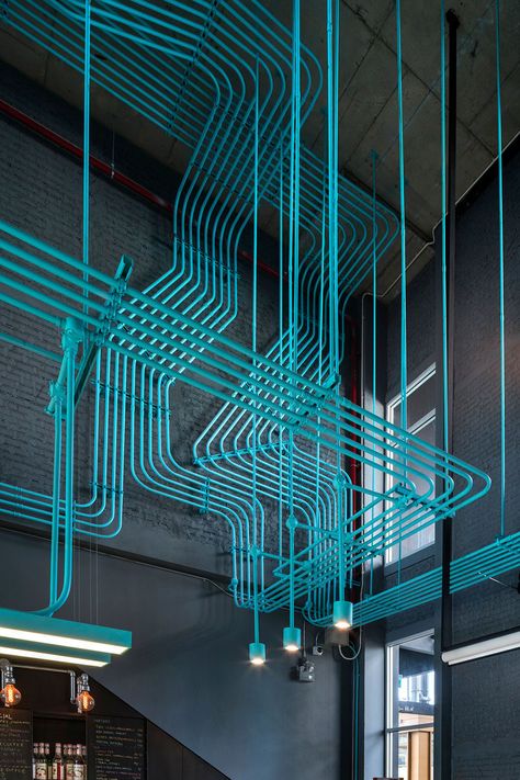 Interior Decor Idea - Turquoise electrical conduit is a design feature running through this co-working office space. Storyboard Ideas, Exposed Ceilings, Electrical Conduit, Coworking Office, Space Interiors, Children Play, Building Ideas, Coworking Space, The Ceiling