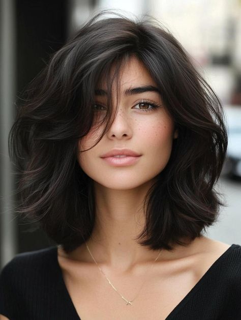 Elevate your hair game with our selection of shoulder length haircuts! Dive into 31 stunning options that offer the best of both worlds. From textured lobs to sleek A-line cuts, find the ideal style to express your personality and simplify your hair routine. Learn pro tips for styling and maintaining your new look throughout the seasons. Haircut Below Shoulder Mid Length, Shoulder Length Bob Black Hair, Shoulder Length Textured Bob With Bangs, Shoulder Length Big Curls, Fluffy Lob Haircut, Layered Volume Haircut Short, 90s Hairstyles Medium Shoulder Length, Above Shoulder Hair With Layers, Mid Shoulder Haircut