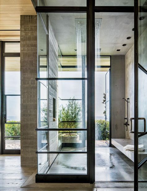 A Malibu, California, master bath features a Dornbracht rain-shower system that’s open to the the elements. The concept was conceived by architect Scott Mitchell and designer Denise Kuriger. | archdigest.com Dressing Design, Malibu Home, Real Estat, Rustic Retreat, Los Angeles Homes, Shower Design, Outdoor Shower, Beautiful Bathrooms, Glass Doors