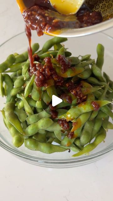 Christy Nguyen on Instagram: "Spicy garlic edamame, the perfect balance of salty, sweet and spicy!   Ingredients:  4 cups of steamed edamame  Sauce: melt 4 tbsp salted butter, then add 2 tbsb minced garlic, 1 tbsp gochujang, 1/2 tsp black pepper, 1/2 tsp garlic powder, 4 tbsp soy sauce, 1 tbsp brown sugar. Heat up and then toss with the edamame.   #edamame #recipes #easyrecipe" Spicy Garlic Edamame Recipes, Edamame Sauce, Spicy Garlic Edamame, Edamame Recipes Spicy, Steamed Edamame, Edamame Snack, Veggie Salads, Edamame Recipes, Veggie Salad