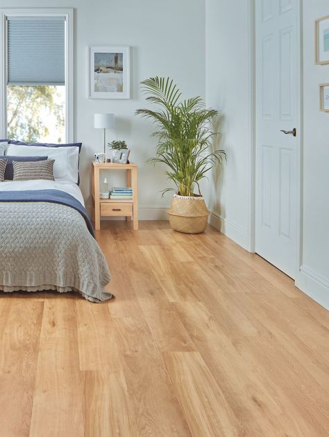 Bedroom with light blond flooring with a bed, side table and plant visible in the background. Karndean French Oak, Wooden Bedroom Flooring, Wooden Bedroom Floor, Bedroom Vinyl Flooring, Light Wood Floor Bedroom, Wood Floor In Bedroom, Oak Floor Bedroom, Wood Flooring Bedroom, Wooden Floor Bedroom Ideas