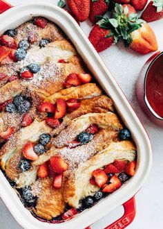 overnight croissant baked french toast with strawberries and blueberries in a stub casserole dish [sponsored] Recipe Croissant, Spring Brunch Party, Croissant French Toast Bake, كريم بروليه, Dessert Crepes, Croissant French Toast, Delicious Breakfast Casserole, Dessert Halloween, Baked French Toast