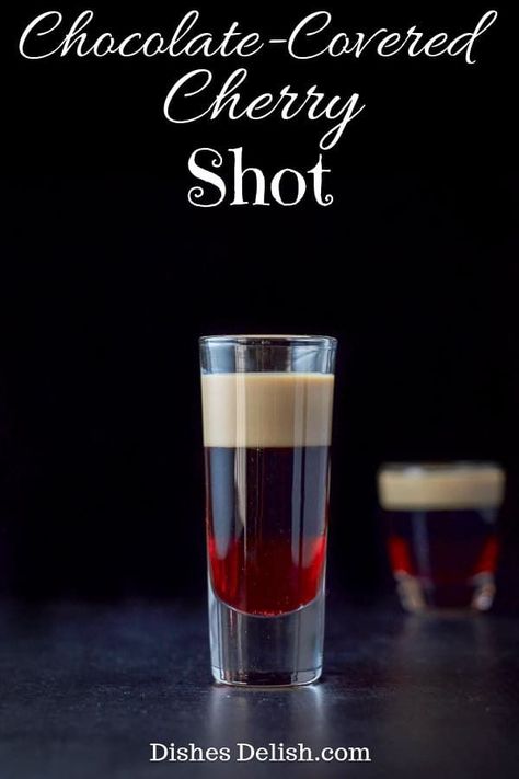 This chocolate-covered cherry shot tastes like the the famous candy!  It is one of the tastiest layered shots out there! #cherry #chocolatecoveredcherry #layeredshot #dishesdelish via @dishesdelish Layered Shots, Glace Fruit, Chocolate Covered Cherry, Chocolate Shots, Cocktail Shots, Shots Alcohol, Liquor Drinks, Chocolate Covered Cherries, Boozy Drinks