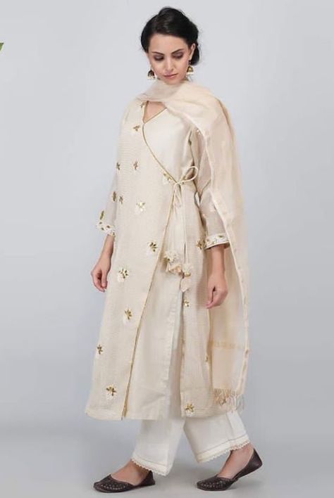 Beautiful Angrakha style Chanderi-Silk  kurti. Embellished with hand embroidery. Angrakha Style Suits For Women, Angrakha Style Kurti Straight, Angrakha Style Shirt, Angrakha Style Kurti, Angrakha Style Anarkali, Palazzo Outfits, Shirt Kurti, Long Kurta Designs, Heavy Suits