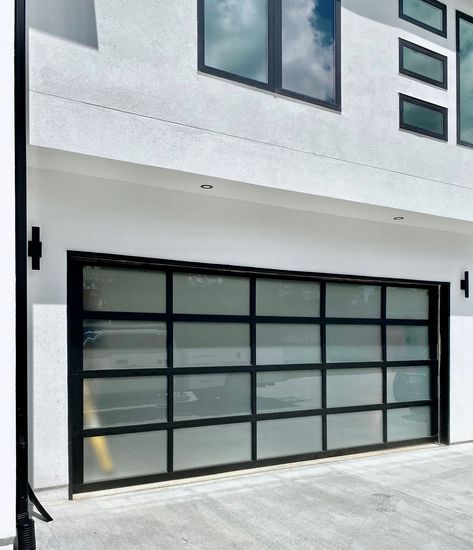 This full-view garage door with frosted windows is the PERFECT addition to this Buford home. #GlassGarageDoor #GarageDoorInstallation #NewDoor #ModernGarageDoor #AaronOverheadDoors #BufordGA Garage Door Frosted Windows, White Modern Garage Door, Frosted Garage Door, Frosted Glass Garage Door, Car Pavilion, Interior Garage Door, Garage Entry Door, Contemporary Garage Doors, Garage Door Windows