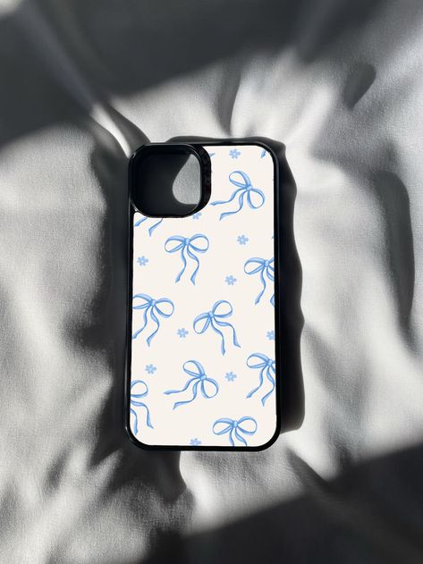 🎀💙 Elevate your phone style with our Blue Ribbon Print iPhone Case! 📱✨ Add a touch of timeless elegance to your device with this charming design featuring a delicate ribbon pattern in shades of blue. 💎🌟 Perfect for those who appreciate classic aesthetics and a touch of sophistication in their accessories. Whether you're heading to a special occasion or simply want to showcase your love for refined details, this case is the epitome of chic simplicity. 💙 Blue Ribbon Aesthetic, Ribbon Aesthetic, Phone Case Inspo, Coquette Phone Case, Ribbon Pattern, Print Iphone, Case Aesthetic, Trendy Phone Cases, Blue Cases