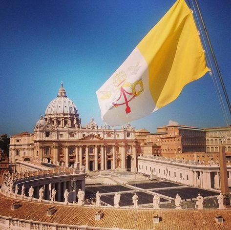 The Vatican flag flies over the plaza of St. Peter's Basilica in Vatican City Vatican Aesthetic, Catholic Flag, Vatican Flag, St Peters Basilica Aesthetic, Vatican City Flag, Le Vatican, St Peters Basilica Architecture, St Basilica Cathedral, St Peter's Basilica Architecture