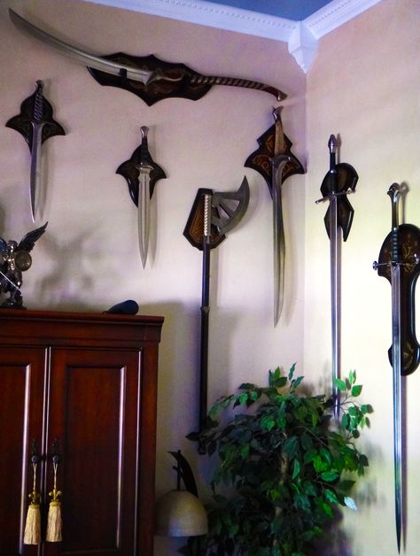 Swords Display Ideas / Lord of the rings / Home office Tolkien Inspired Home, Lotr Interior Design, Archeology Bedroom, Lotr Room Ideas, Swords Decor, Lord Of The Rings Room Decor, Lotr Room Decor, Lord Of The Rings Bedroom, Lord Of The Rings Room