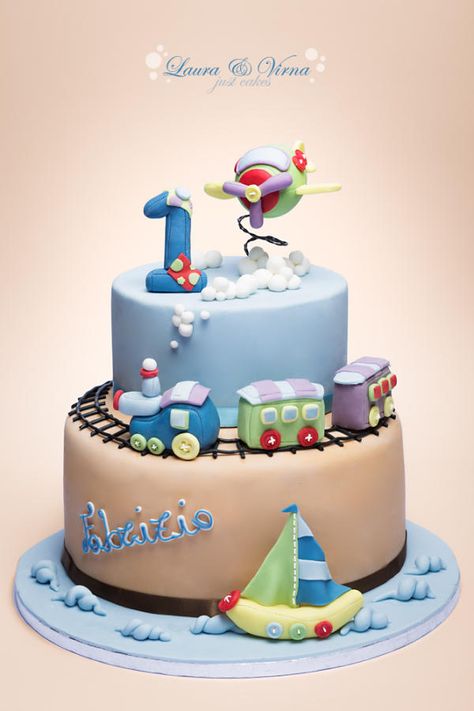 A cake for the first year of a baby boy. It includes the sea, ground and sky with the most popular toys for boys. Birthday Cake Dinosaur, Sailboat Cake, Rodjendanske Torte, 1st Bday Cake, Baby Boy Birthday Cake, Train Cake, Boy Cake, Airplane Baby, 1st Birthday Cakes