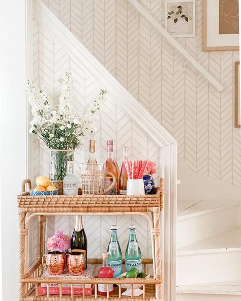 Rattan bar carts to usher in the cocktail hour. The bar carts in use today reemerged in the 50s and 60s—the era of cocktail parties. Bar Cart Inspo, Bar Cart Essentials, Apartment Bar, Rattan Bar Cart, Rattan Bar, College House, Bar Cart Styling, College Apartment Decor, Bar Cart Decor