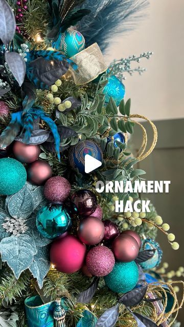 Becca Mansfield | Party Creator 🎉 on Instagram: "I can’t believe how this ORNAMENT HACK transformed my peacock tree! 😱🤩  If you want your tree to be a SHOWSTOPPER, try this trick by stringing ball ornaments onto fishing line until they make a cluster or ornament swag 🎄  Then tie or wrap both ends into branches of your tree!   I mixed some different textures and colors for a dramatic effect,   But you could also go monochrome for a more sophisticated look ✨🤩  They remind me of all the balloon clusters I make (see all my party reels 😆) so it made me SO HAPPY to put these on the tree 👏🏻   Have you tried this method yet!?  Follow along to see all the rest of the holiday ideas up our sleeves!   🦚Becca   …..  ….. Christmas tree idea | Christmas tree decorating | ornament hack | fishing Beach Theme Tree, Cluster Tree Ornaments, Making Ornament Clusters, How To Make Cluster Ornaments, Peacock Tree Christmas, Christmas Tree Cluster Decorating Ideas, How To Make Ornament Clusters, Christmas Ball Clusters On Tree, How To Cluster Christmas Balls