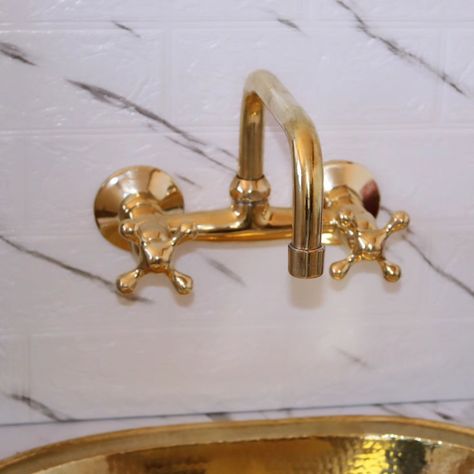 Brass Wall-Mounted Faucets: A Stylish Choice for Your Space Wall-mounted faucets have gained popularity for their sleek design and practicality. Unlike traditional faucets that sit on the sink or countertop, wall-mounted faucets are directly attached to the wall, creating a clean and modern look. When it comes to brass wall-mounted faucets, you’ll find a variety of styles, finishes, and handle options to suit your taste #BrassFaucet #WallMountedFaucet #BathroomDecor #HomeImprovement #Interi... Traditional Faucet, Brass Faucet, Brass Wall, Bathroom Remodel, Bathrooms Remodel, The Wall, Sleek Design, Faucet, Countertops