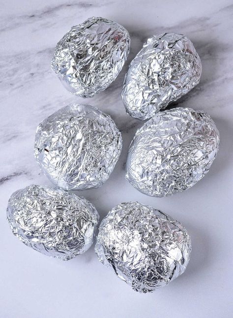 This is how long to bake potatoes at 375 in foil so the insides are fluffy and how to make baked potato skins crispy when done too. Peeled Baked Potatoes In The Oven, Whole Potatoes In Oven, Oven Baked Potato In Foil, Baked Potatoes In Foil In The Oven, Oven Baked Potatoes In Foil, How To Bake A Potato In The Oven In Foil, How To Bake Potatoes In Oven, Oven Baked Red Potatoes, Baked Yukon Gold Potatoes