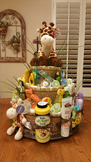 Jungle theme diaper cake Jungle Theme Gifts, Diaper Cake Safari Theme, Jungle Theme Diaper Cake, Safari Diaper Cake, Baby Shower Baskets, Boy Baby Shower Ideas, Diaper Cake Boy, Jungle Baby Shower Theme, Nappy Cakes