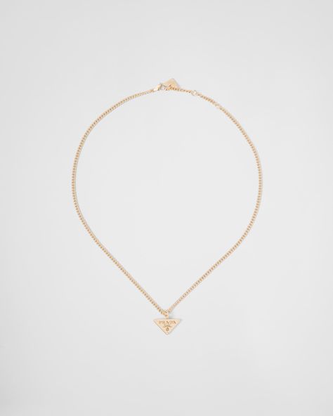 Find PRADA Eternal Gold Pendant Necklace In Yellow Gold With Diamonds on Editorialist. 750 Yellow Gold (18 kt) with diamonds Diamonds: 3 diamonds - Total carats: 0.024 ct - Cut: brilliant - Color: G+ - Clarity: VS Triangle pendant Lobster claw clasp Length 45 cm (17.71 inches) adjustable to 43 cm (16.92 inches) and 41 cm (16.14 inches) Made in Italy Each step of Prada's responsible gold and diamond production chain is verified and traceable thanks to Aura Blockchain technology. Womens Silver Jewelry, Luxe Jewelry, Golden Necklace, Triangle Necklace, Triangle Pendant, Jewelry Lookbook, Fine Jewelry Collection, Blockchain Technology, Minimalist Necklace