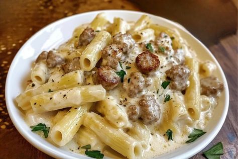 Indulge in the ultimate comfort food with this rich and creamy rigatoni dish, featuring savory beef sausage and a luscious Alfredo sauce that hugs every bite. Perfect for a cozy dinner or impressing your guests, this recipe is a guaranteed crowd-pleaser. Hungry? Click for the full recipe #CreamyPasta #BeefSausage #RigatoniRecipe #AlfredoPasta #EasyDinnerIdeas #PastaLovers #DinnerInspiration #ComfortFood #QuickMeals #HomemadePasta #SausagePasta #DeliciousDinners Alfredo Rigatoni, Creamy Rigatoni, Sausage Alfredo Pasta, Sausage Alfredo, Rigatoni Recipes, Pasta Recipes Alfredo, Rigatoni Pasta, Homemade Alfredo, Cozy Dinner