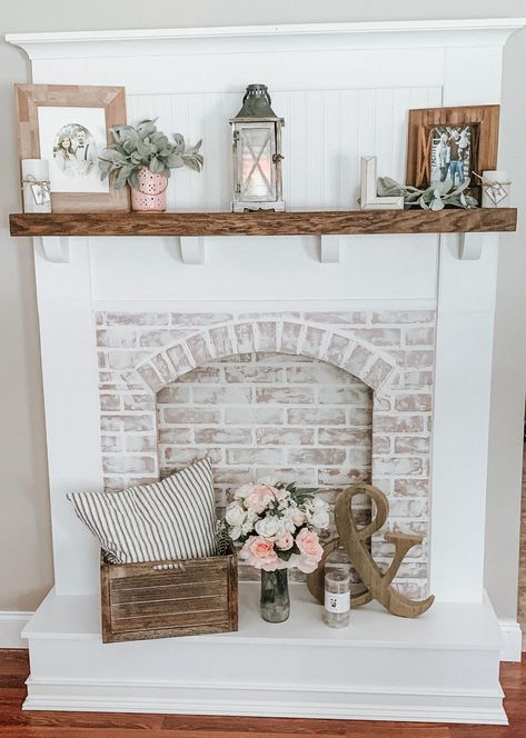 Our custom built faux fireplace decorated in french country/farmhouse decor Fireplace Filler Ideas, Farmhouse Faux Fireplace, Pellet Stove Ideas Living Rooms, Wood Burning Stove Ideas, Fireplace Filler, Pellet Stove Ideas, Empty Fireplace Ideas, Stove Hearth, Wood Stove Hearth