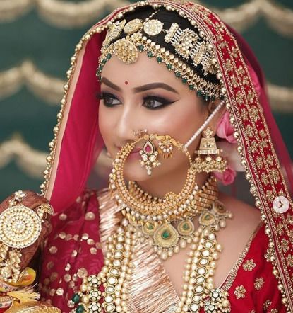 We are sure you would like this large bridal Nath. It may have caught your attention because of how well it complemented the old style. It goes well on broad faces and girls with double chin. Nath Designs, Nath Bridal, Bridal Nath, Marathi Bride, Blessed Wednesday, Sabyasachi Bride, Bridal Makeup Images, Indian Bridal Photos, Contemporary Bride