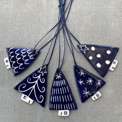 Each decoration is hand made from white earthenware clay, decorated with coloured slips and a hand drawn scraffito design. Navy cotton thread is attached to allow the decorations  to be hung.  made from: White earthenware clay and ribbon.  dimensions: Each decoration measures  approx between 4 - 5cm x approx between 3-4cm    (excluding thread )  Please note that designs, sizes and colours may vary slightly from the photo as they are all individually made and therefore unique.  Free postage. Air Dried Clay Christmas Decorations, Christmas Ornaments Pottery, College Christmas, Pottery Idea, Christmas Ceramics, Clay Christmas Decorations, Hygge Christmas, Christmas Date, Bazaar Ideas