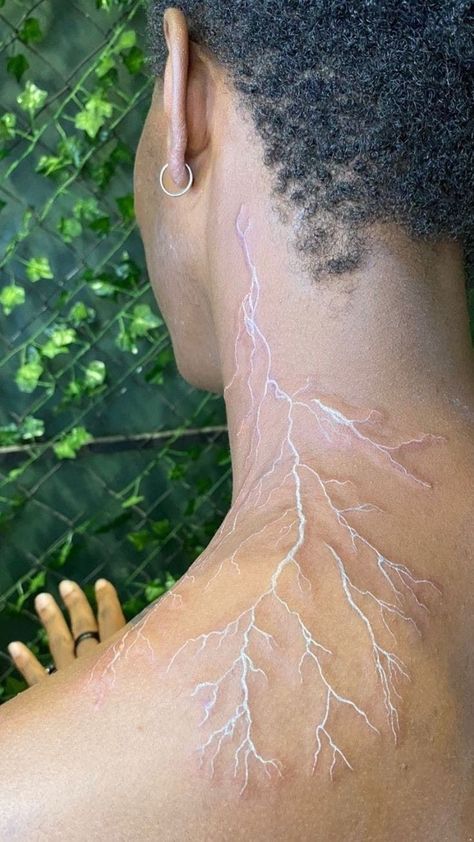 Lightning Marks On Skin, Lighting Tatoos Men, Red Veins Tattoo, Lightning Spine Tattoos For Women, White Ink Tattoos On Dark Skin, White Tattoo Black Skin, Red Vein Tattoo, White Tattoo Lightning, Lightening Tattoo On Shoulder